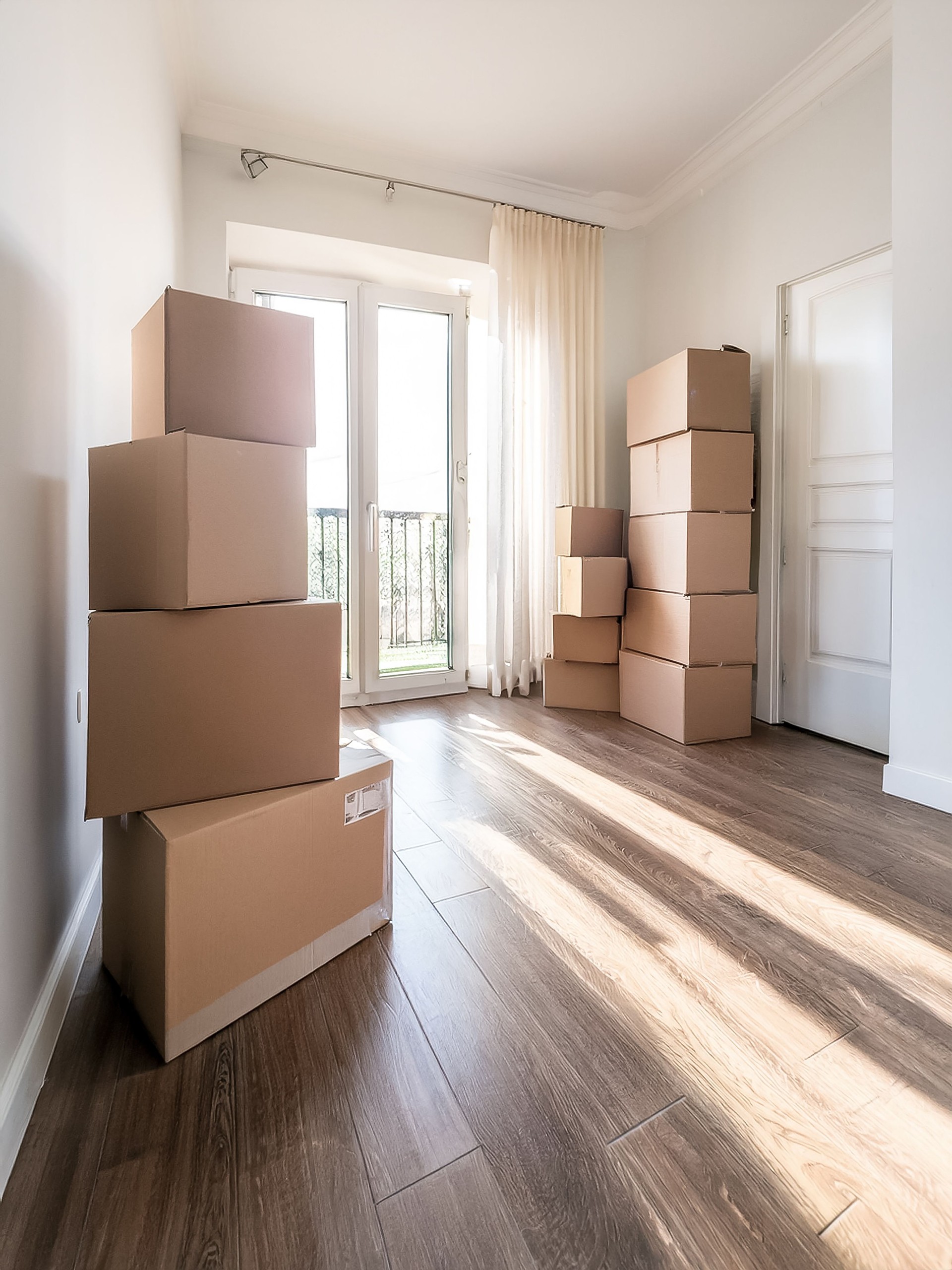 Moving Boxes Stand In An Empty Apartment